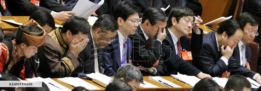 Tired participants in China's parliament session