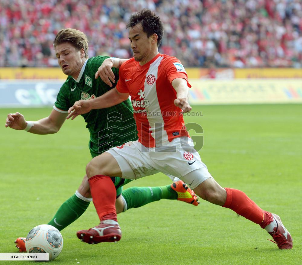 Japan forward Okazaki in action in Mains-Bremen game