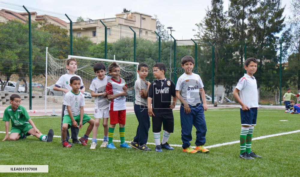 Children practice soccer in Algiers