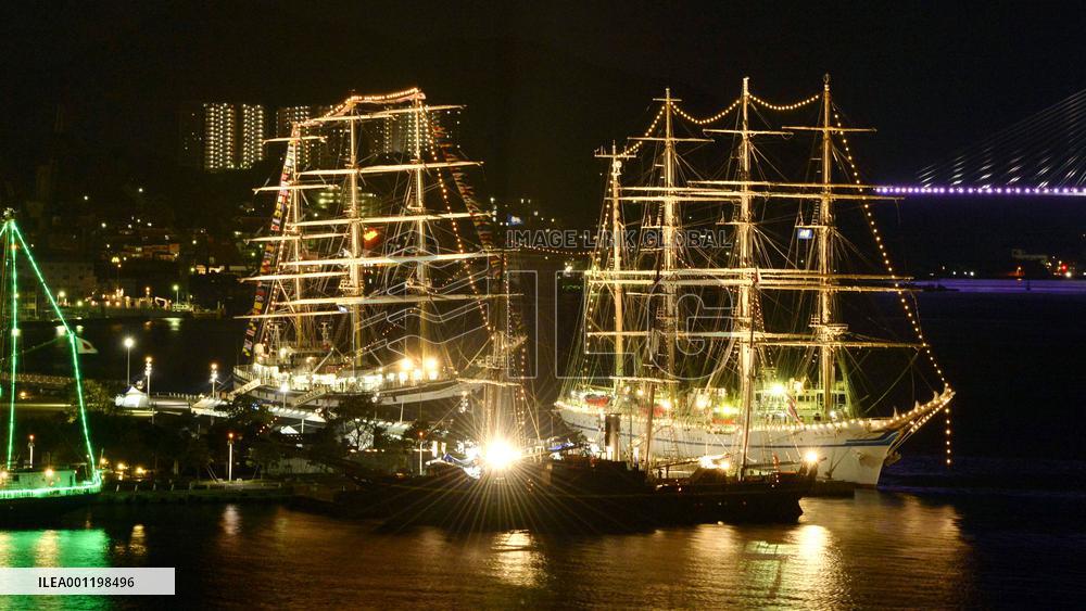Tall ships brightly lit up at Nagasaki port festival