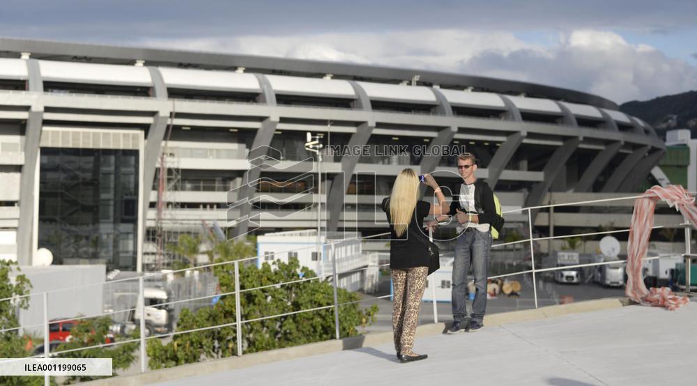 Couple takes picture before Rio World Cup stadium