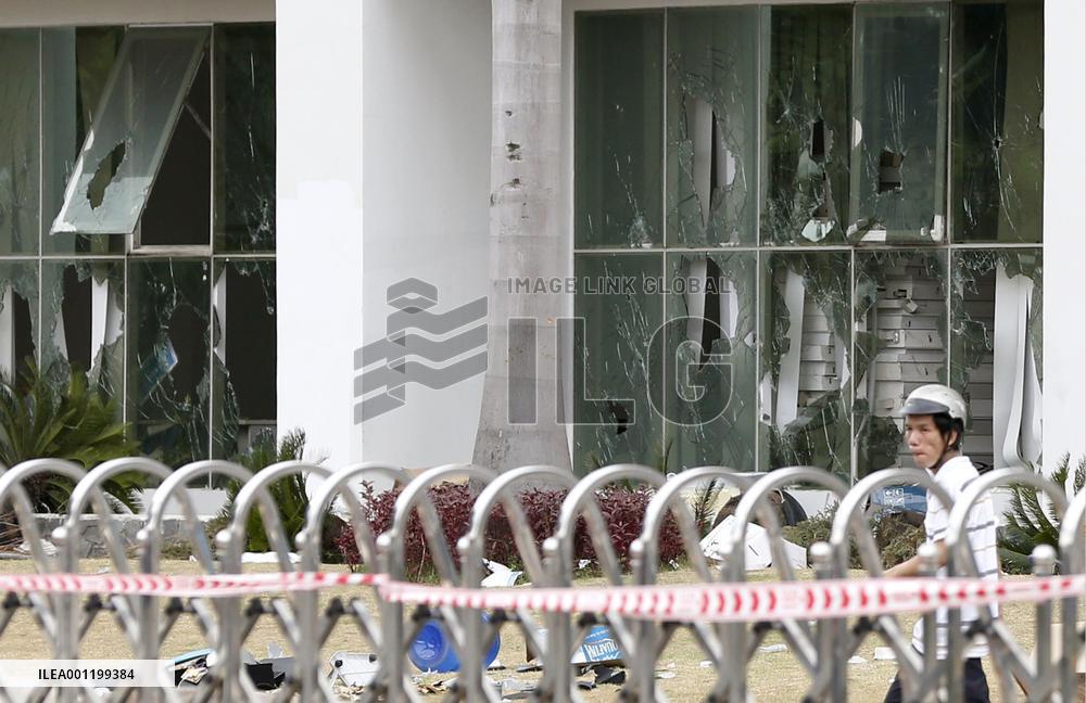 China company office attacked by anti-Chinese protesters