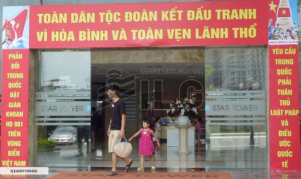 Signboards in Vietnam protest China's oil hunt in disputed sea