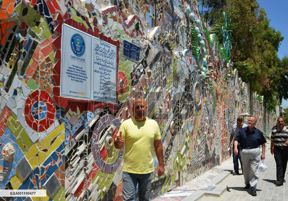 Syrian artist makes world's biggest mural of recycled scraps