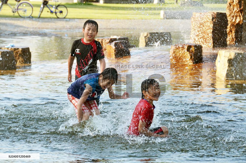 Kids play in water amid record heat in Hokkaido town