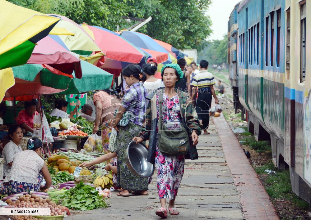 Shoppers at railway platform market in Yangon