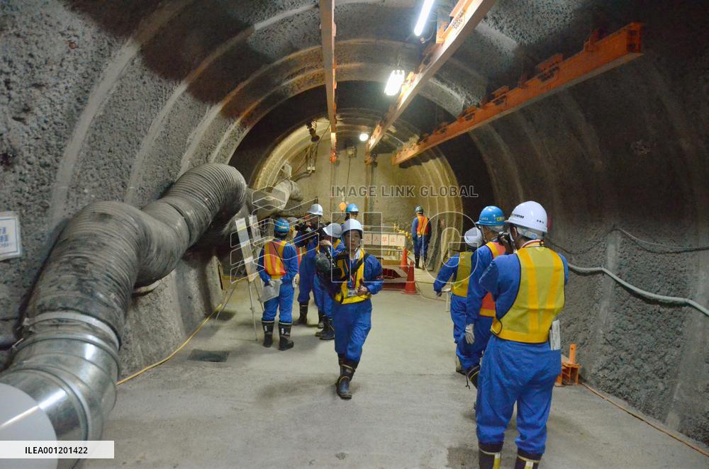 Test burial pit for radioactive waste opened to press