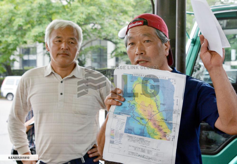 Fukushima cattle farmer brings cow for protest at farm ministry