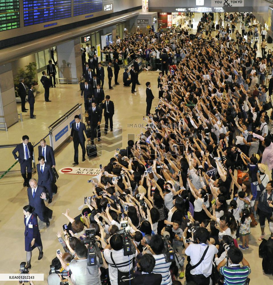 Japan team returns home from Brazil