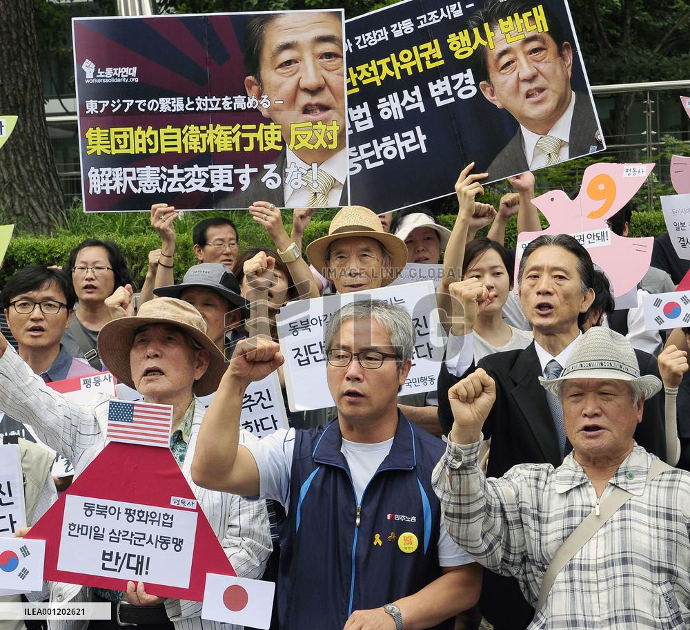 Cabinet OKs collective self-defense, reinterprets Constitution