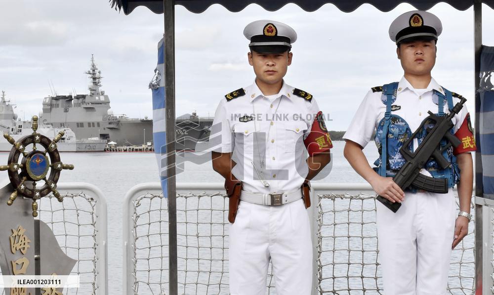 Chinese officers on guard aboard destroyer during RIMPAC