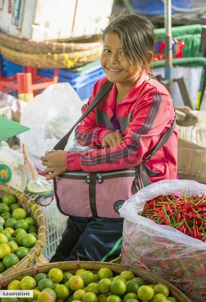 Child vendor at market in Phnom Penh