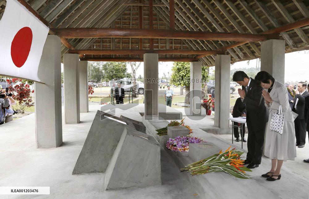 Japan PM Abe visits war memorial in Papua New Guinea