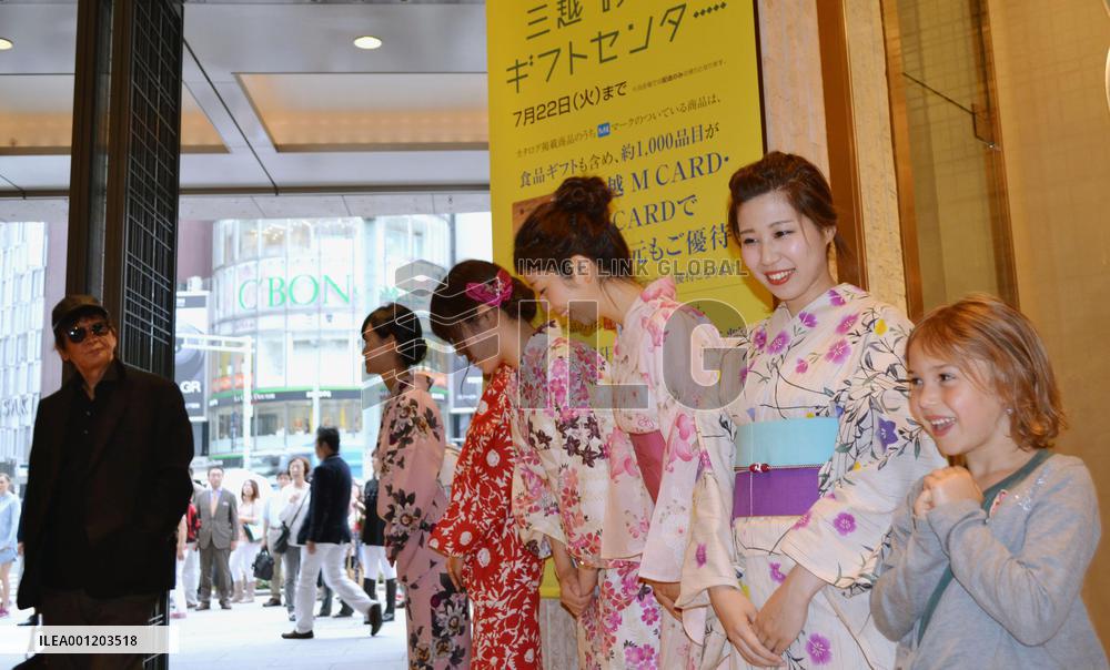 Mitsukoshi clerks in 'yukata' welcome shoppers