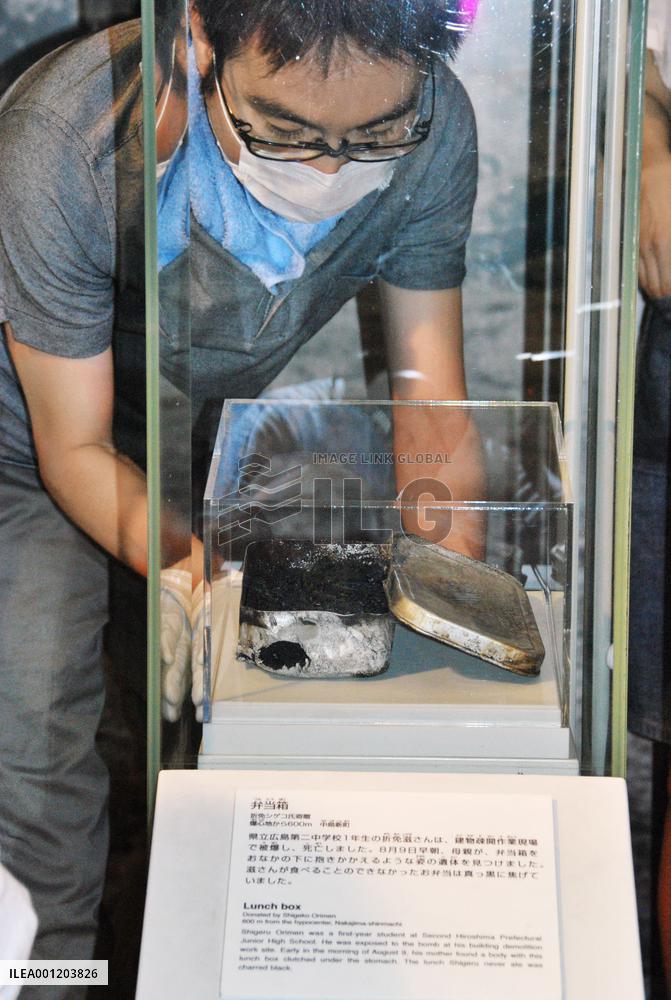 A-bombed lunch box put back into showcase after cleaning