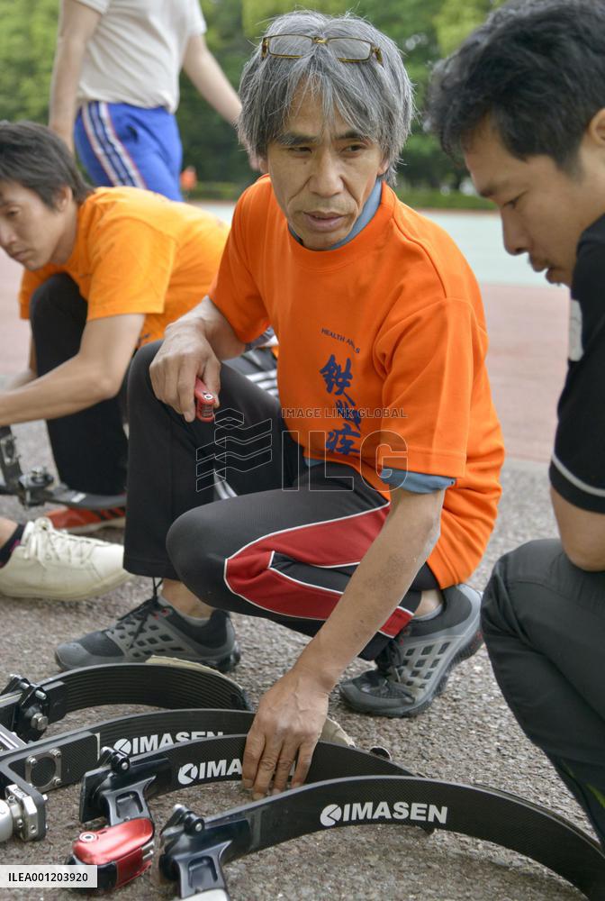 Experts Usui checks prosthetics for athletes
