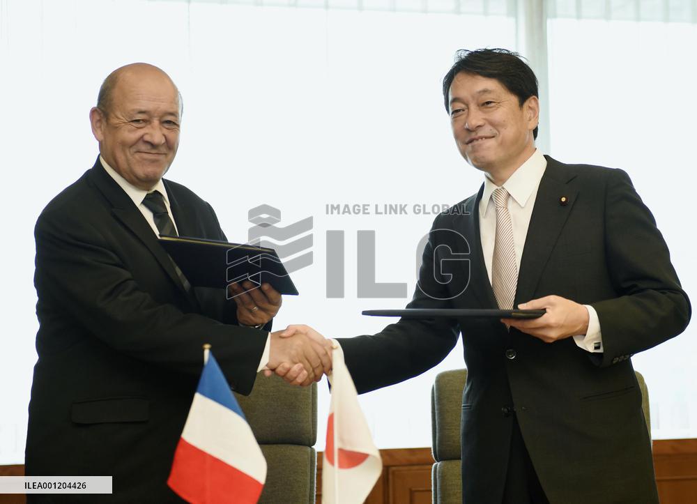 Japan, France defense chiefs shake hands in Tokyo