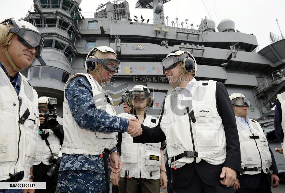 Japan defense minister visits U.S. Navy aircraft carrier