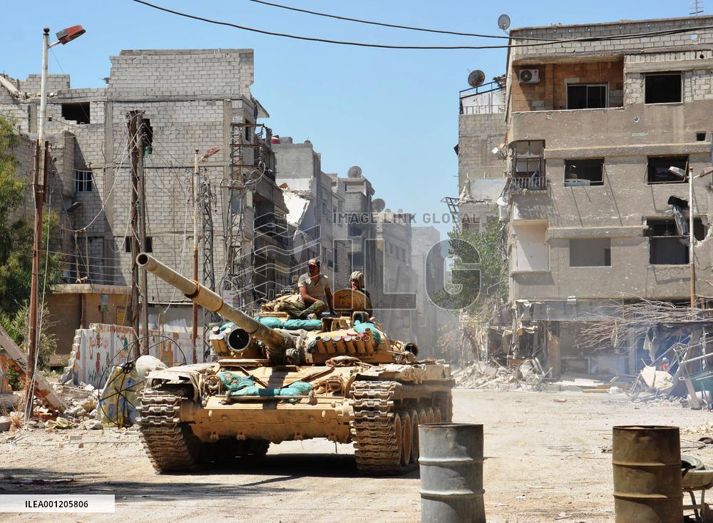 Syrian tank patrols in recaptured Damascus suburb