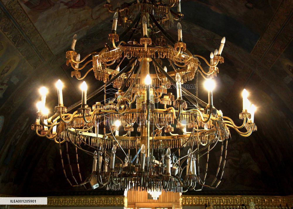 Chandeliers made of weapons parts feature Serbian church