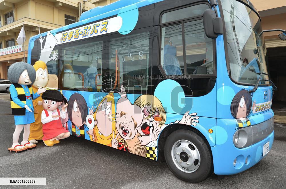 Bus with comic characters runs in author's hometown