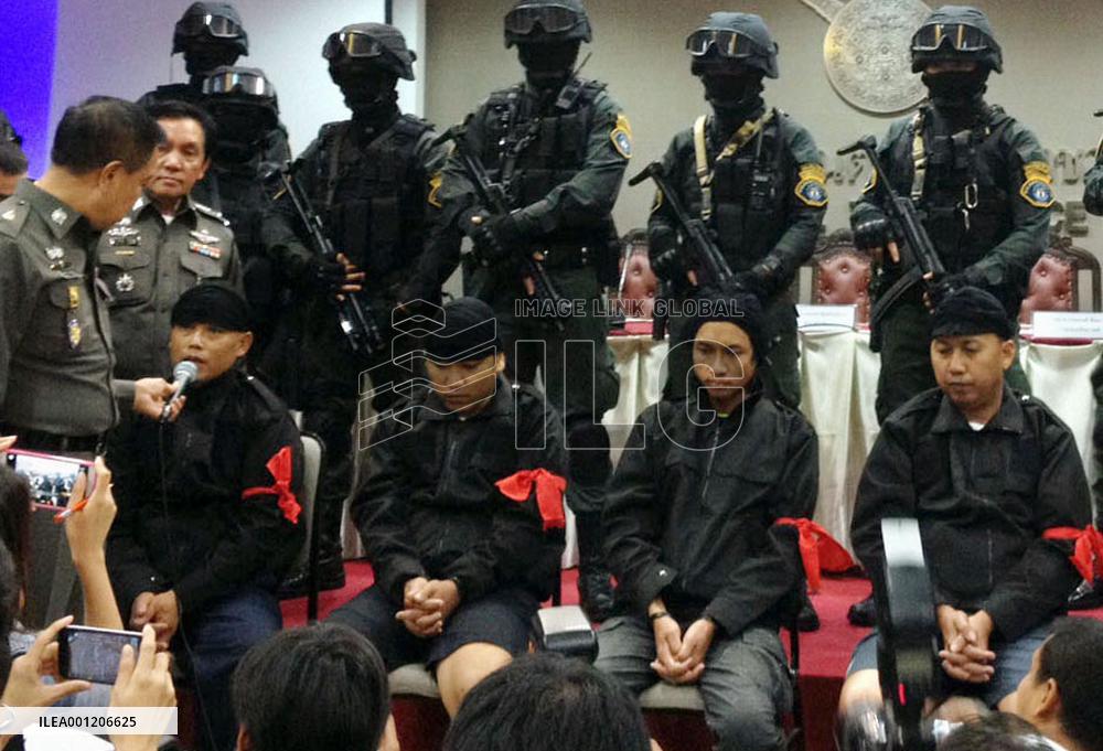 'Men in black' arrested in Thailand