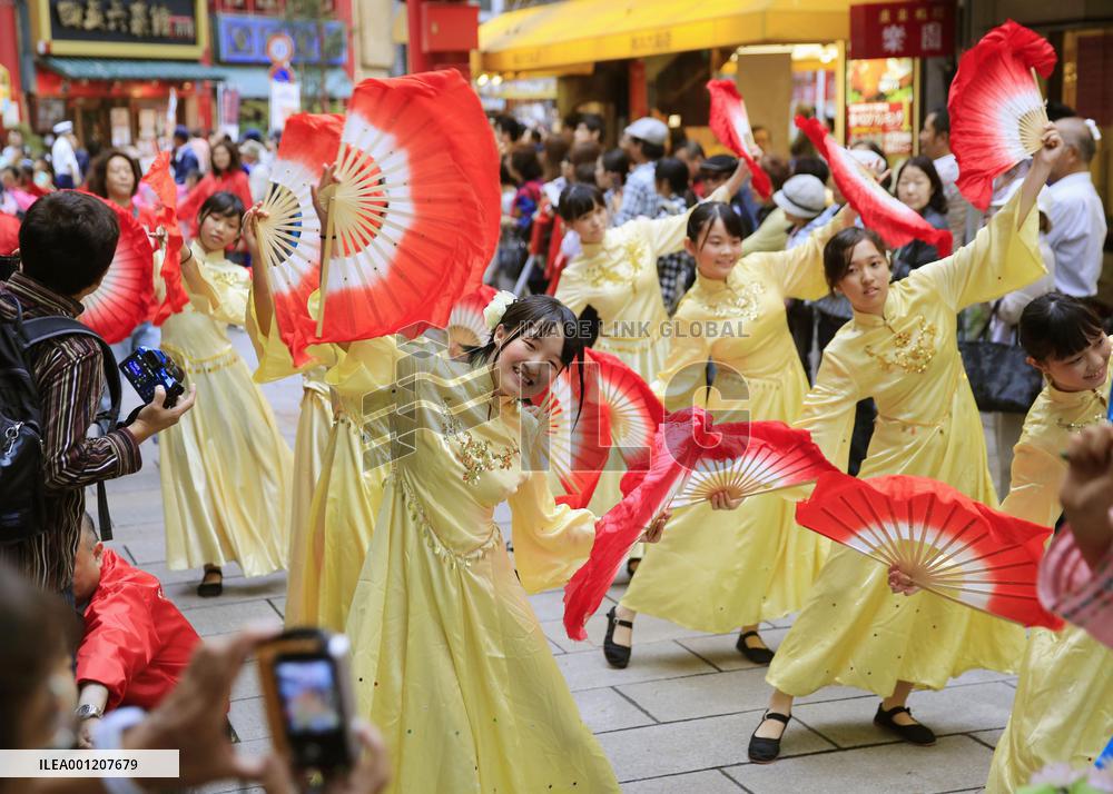 Women dance for China's National Day in Yokohama Chinatown