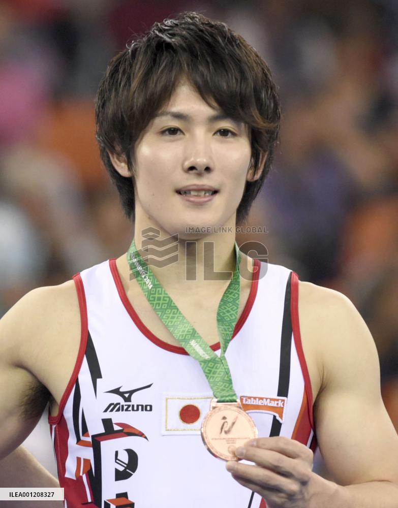 Japan's Kato wins bronze in parallel bars at world championships