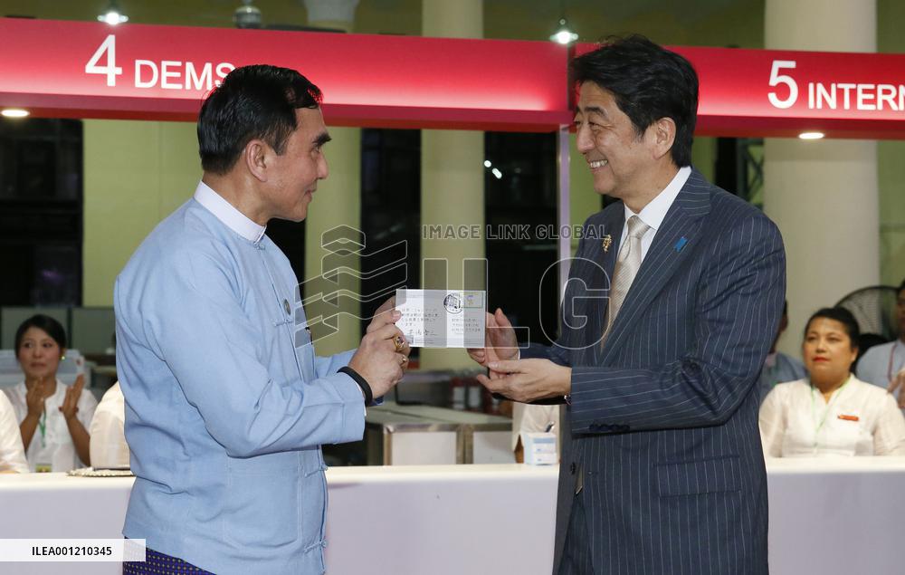 Abe visits post office in Yangon