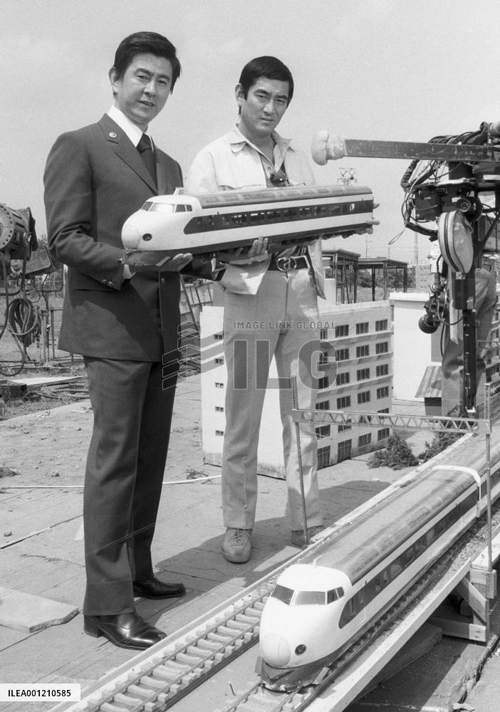 Actor Takakura holds train model for disaster film