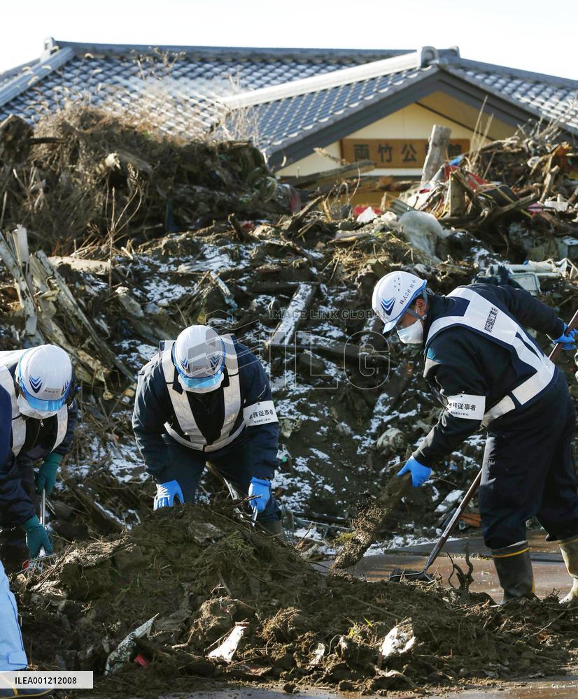 Debris removal starts in town near crippled reactors
