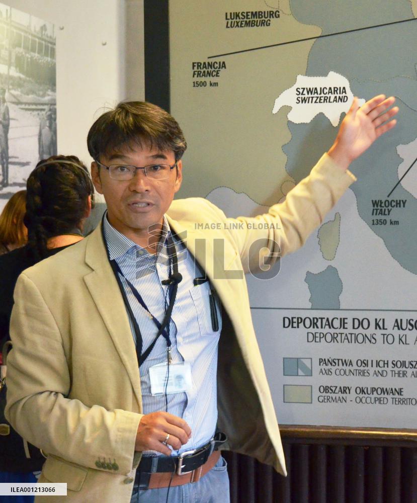 Sole Japanese tour guide at Auschwitz museum at work