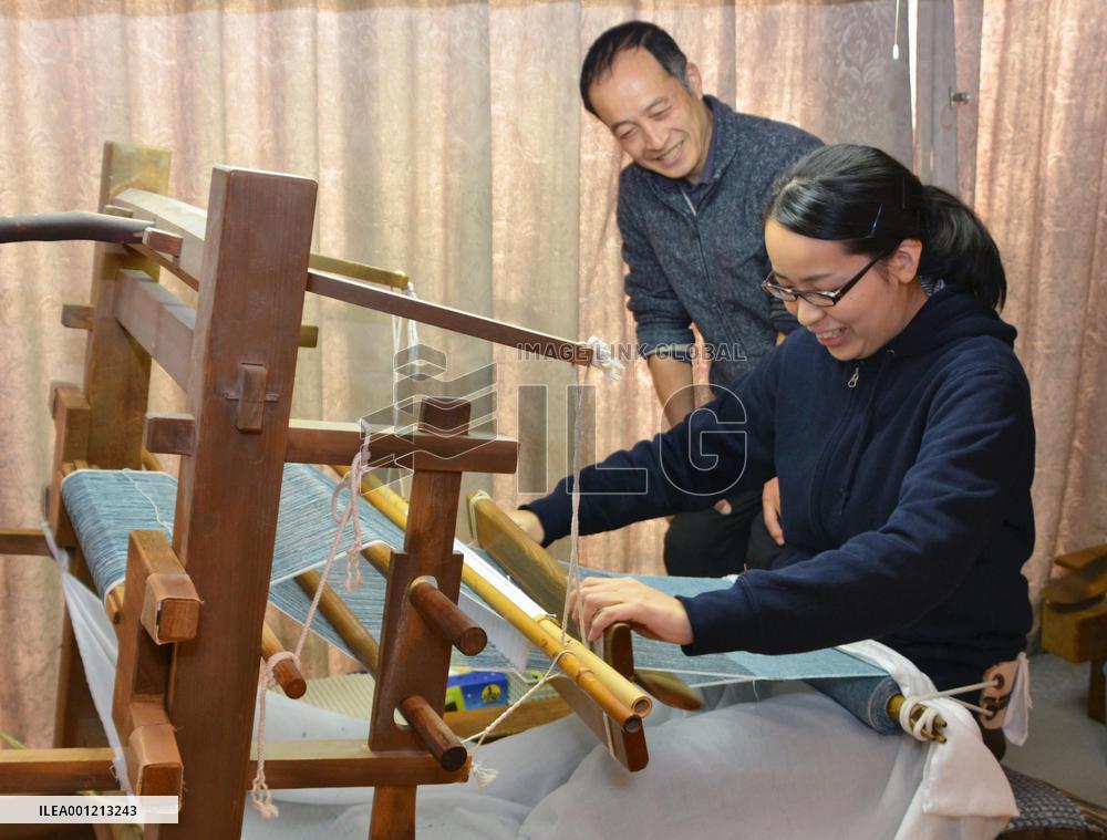 Yuki-tsumugi weaver under training in Tochigi Pref.