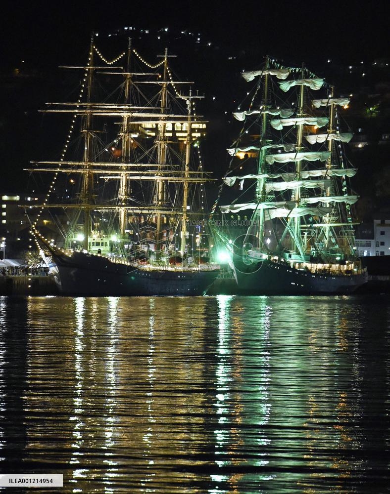 Japanese, Russian sailboats lit up at Nagasaki port festival