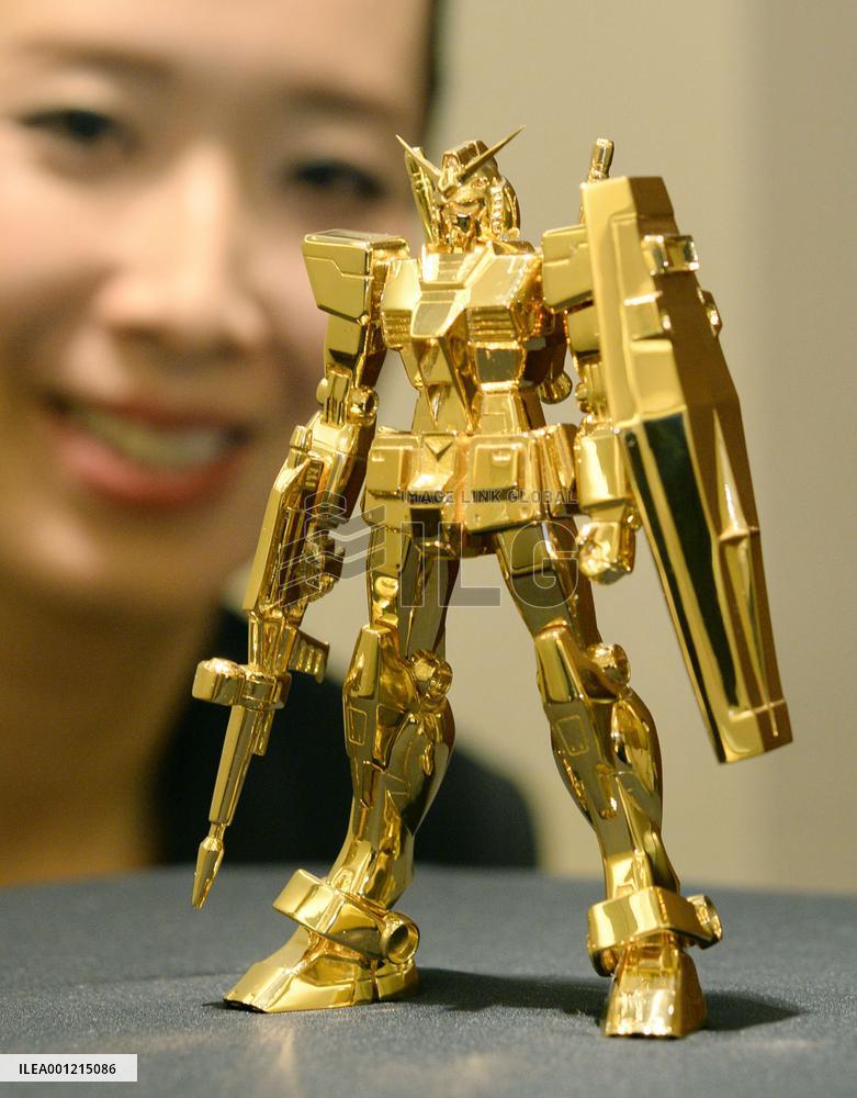 Solid gold Gundam figurine on display in Osaka
