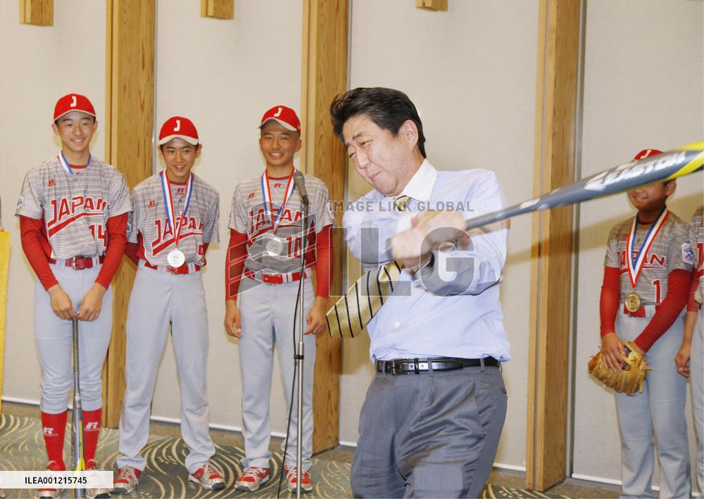 Abe with young baseball players