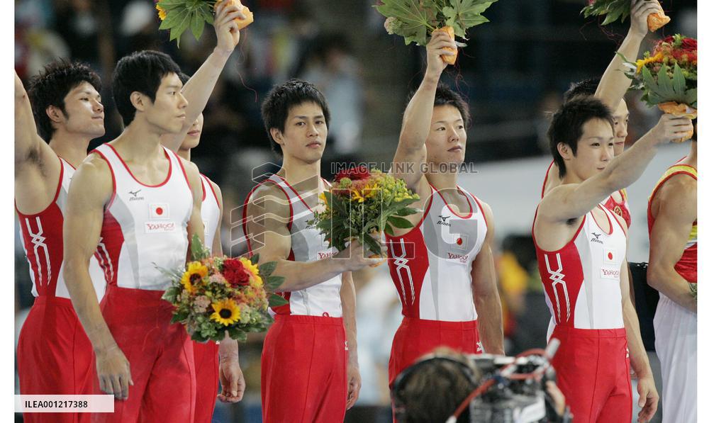 Japan takes silver in men's team event, China wins