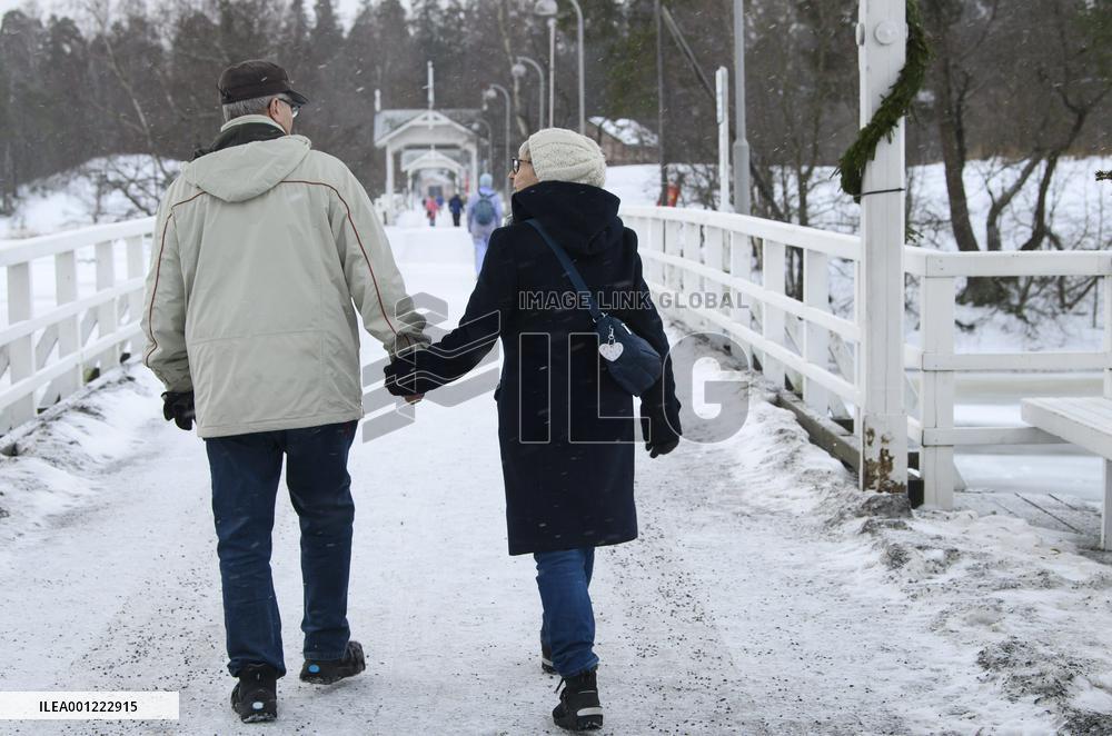 An elderly couple outdoors.