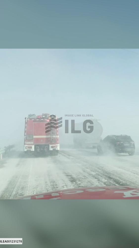 Firefighters rescue 27 people trapped on highway in Xinjiang blizzard