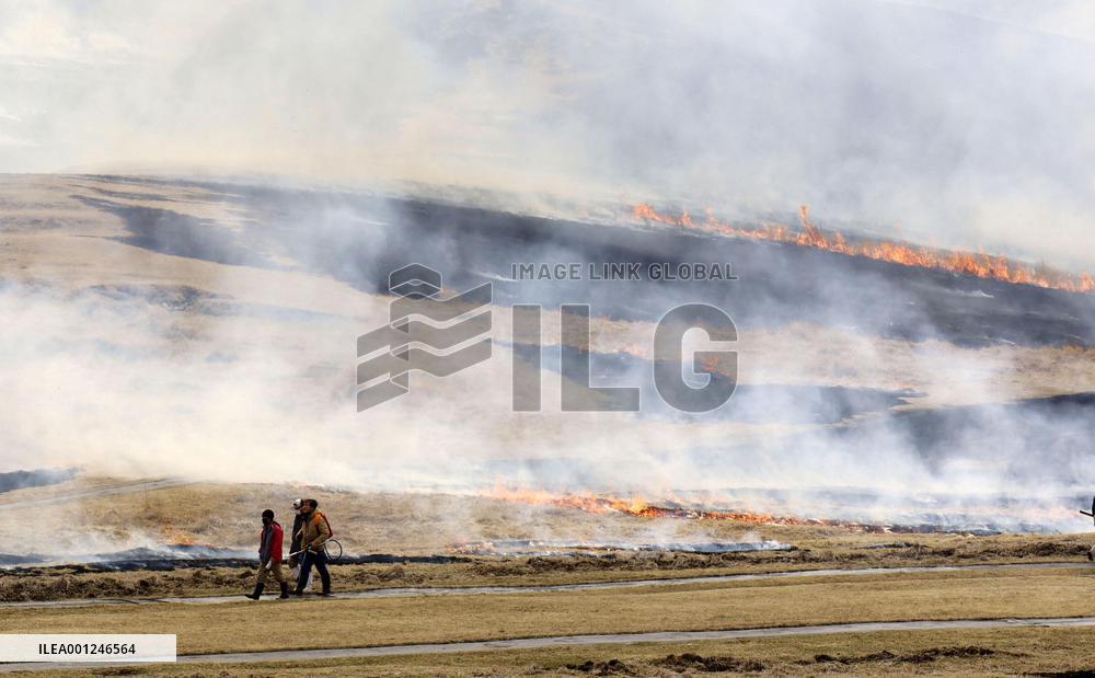 Controlled grassland burning at Mt. Aso