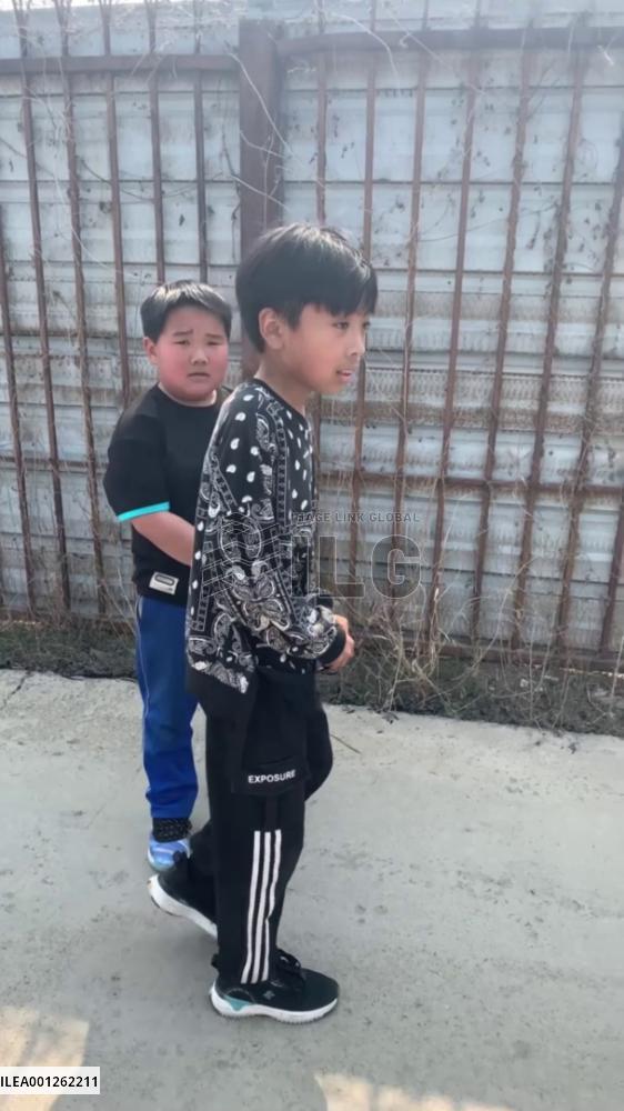 Kid salutes firefighters after fire extinguished