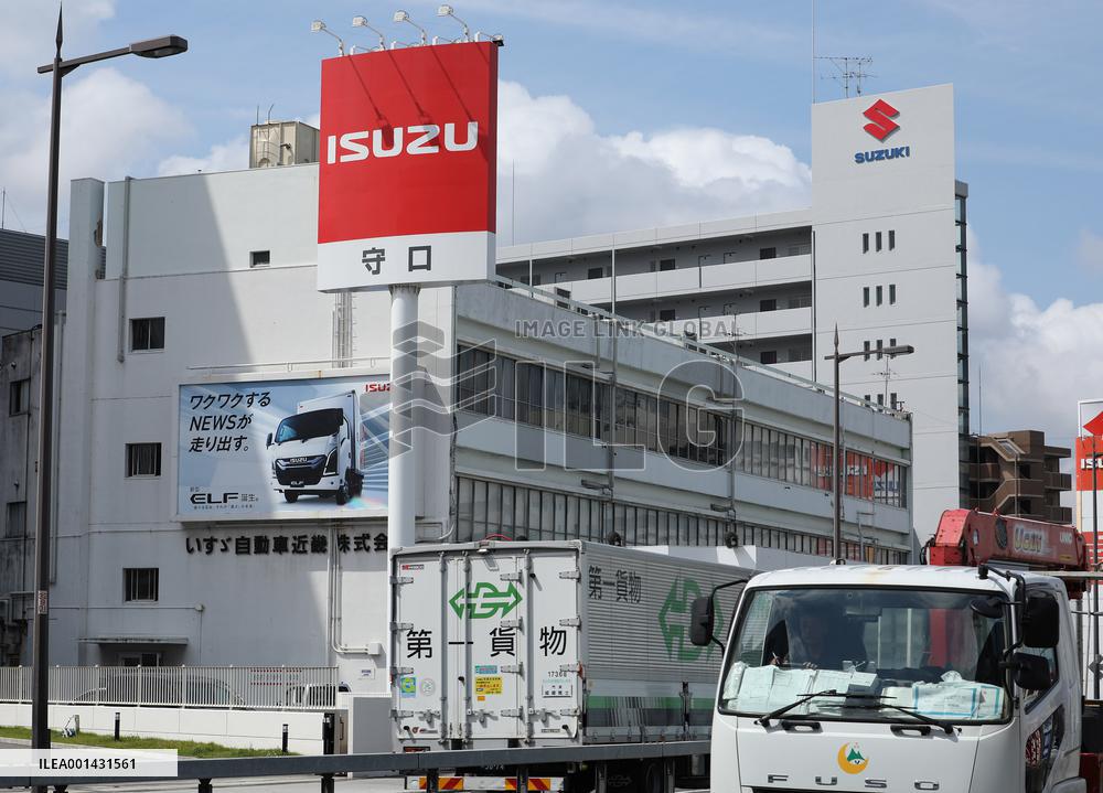 Logo and signage for Isuzu dealership.