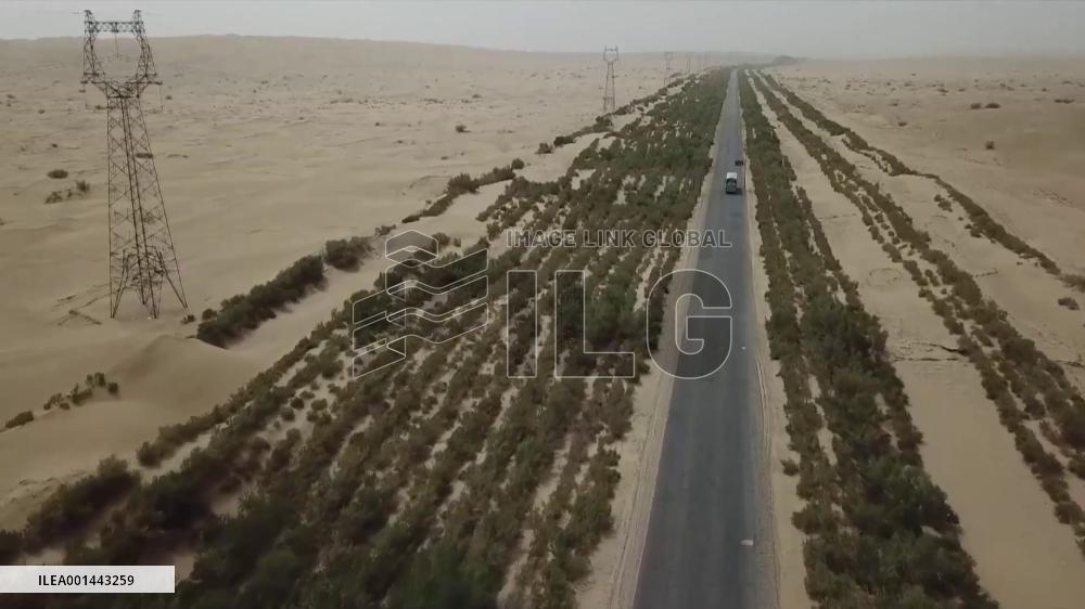 Green corridor traverses shifting sand desert in China's Xinjiang