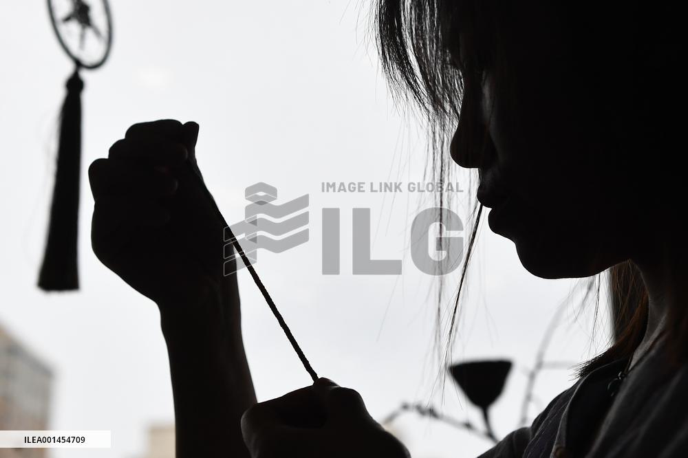 CHINA-JILIN-STRING-WEAVING-INTANGIBLE CULTURAL HERITAGE-INHERITOR (CN)