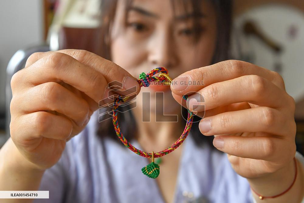 CHINA-JILIN-STRING-WEAVING-INTANGIBLE CULTURAL HERITAGE-INHERITOR (CN)