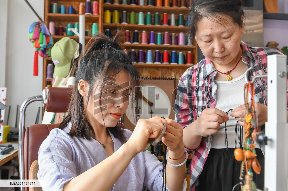 CHINA-JILIN-STRING-WEAVING-INTANGIBLE CULTURAL HERITAGE-INHERITOR (CN)