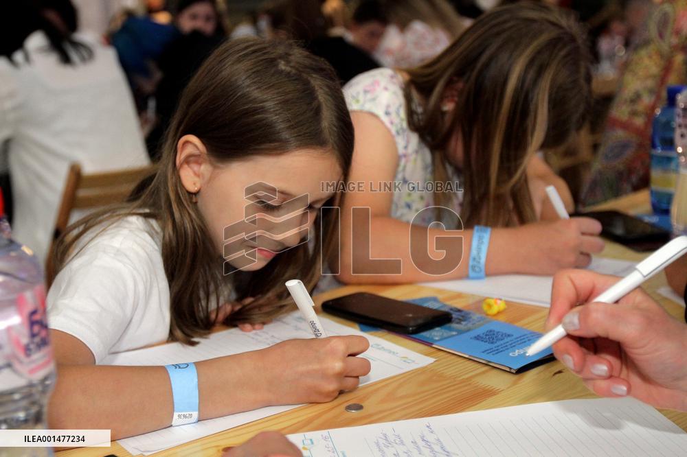 Dnipro residents write dictation in subway on Constitution Day