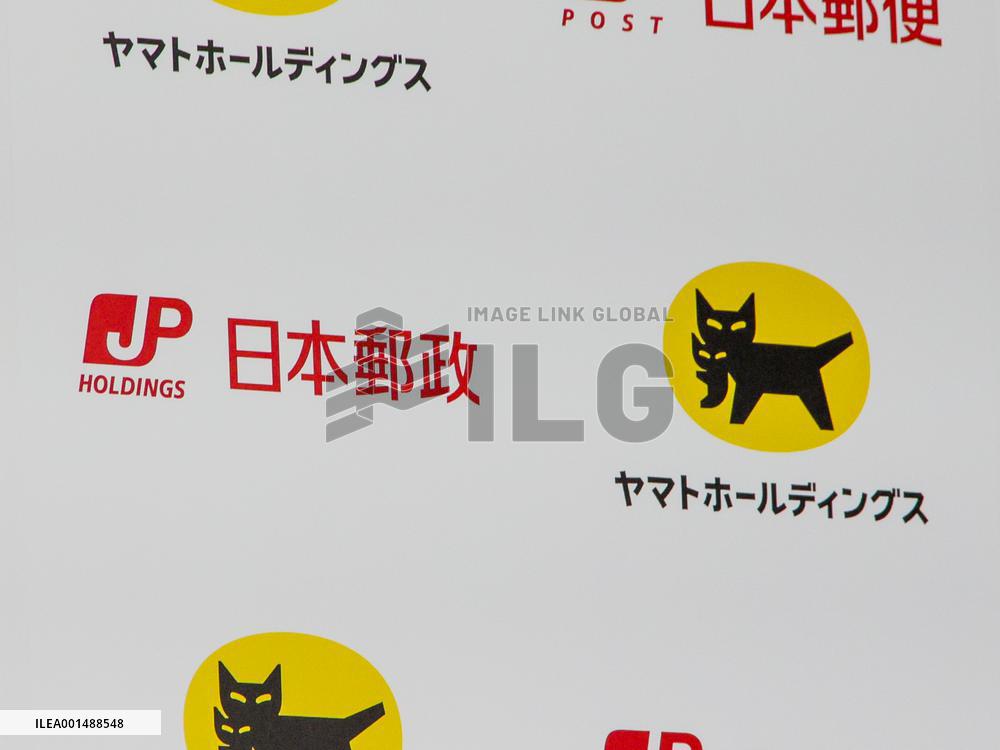 Logos of Japan Post and Yamato Holdings
