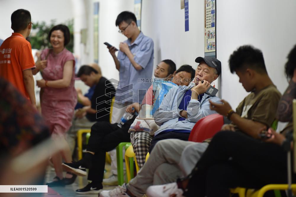 Citizens Cool Off in An Air-raid Shelter in Nanjing