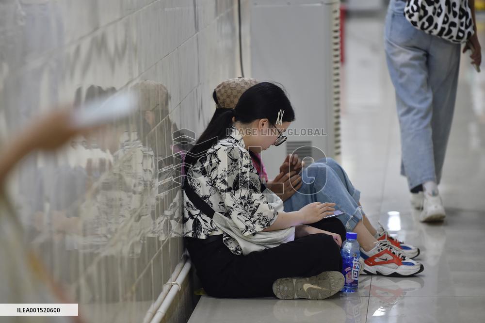 Citizens Cool Off in An Air-raid Shelter in Nanjing